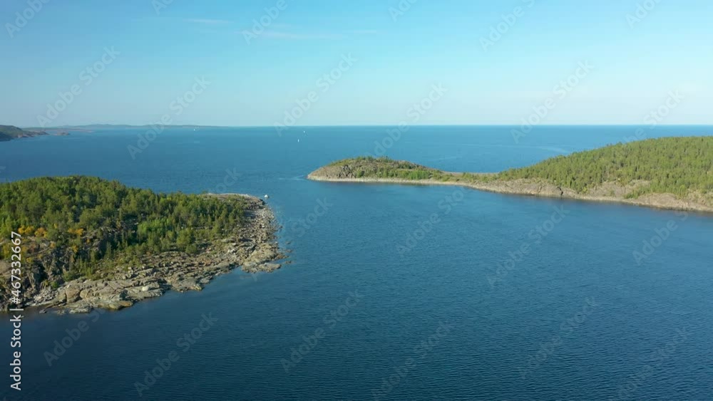 Remote rocky islands in middle of the blue ocean, aerial drone view Remote rocky islands in middle of the blue ocean, aerial drone view