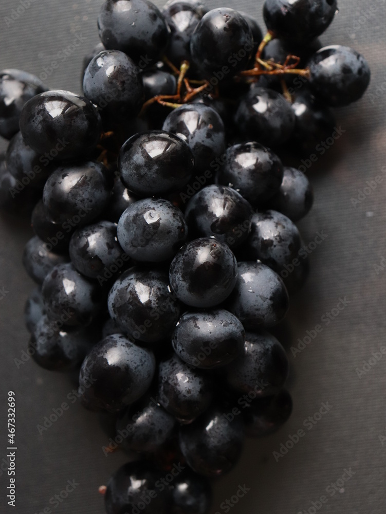 black grapes on black background