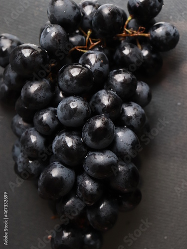 black grapes on black background