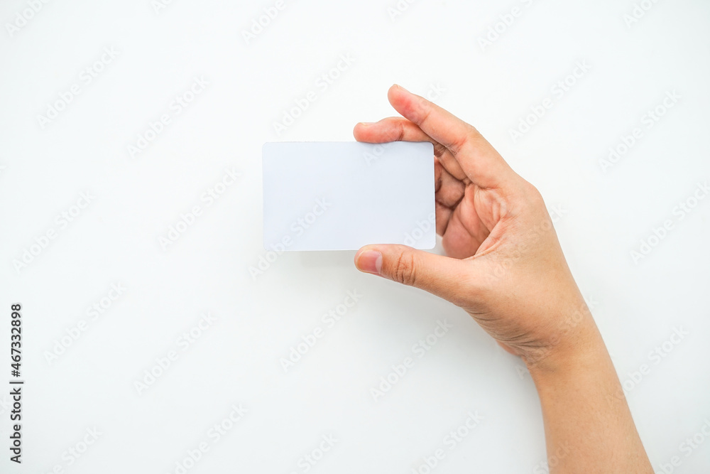 Fototapeta premium a right hand holding an empty white space on a white background. a mockup that is suitable for business or identity mockup use.