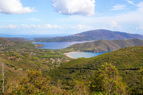 High angle view over gulf of Lacona and peninsula of capo stella with its lush vegetation, on Island of Elba, Italy photo