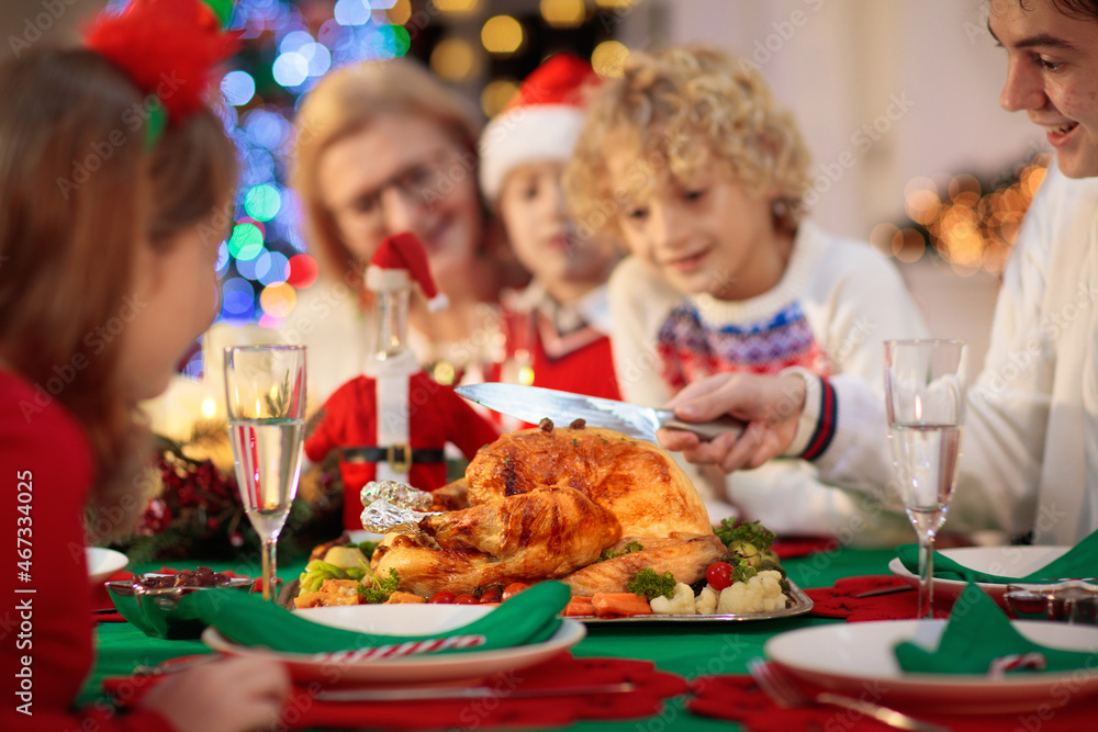 Christmas dinner. Family with kids at Xmas tree. Christmas dinner. Family with kids at Xmas tree.