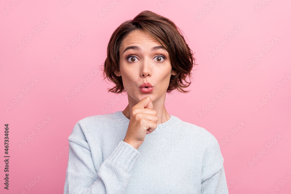 Photo of shocked amazed happy young woman hold hand chin sale news face isolated on pink color background Photo of shocked amazed happy young woman hold hand chin sale news face isolated on pink color background