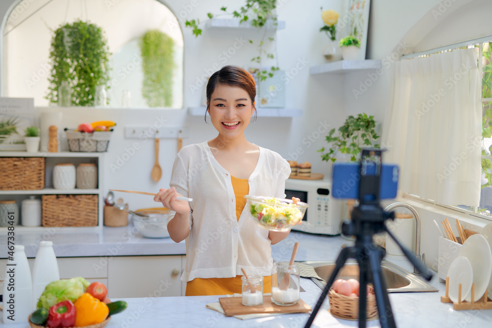 food blogger recording video with phone camera at home kitchen food blogger recording video with phone camera at home kitchen