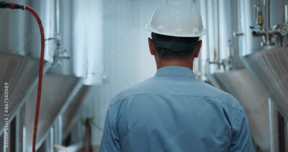 Portrait of professional industry engineer. Technician engineer wearing safety helmet . Large industrial factory background Portrait of professional industry engineer. Technician engineer wearing safety helmet . Large industrial factory background