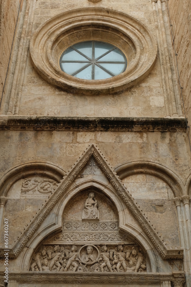 Stone decoration. Tympanum and portal of the transept.Decorations on the stone of the cathedral of Cagliari. Cagliari, Sardinia,  Italy.