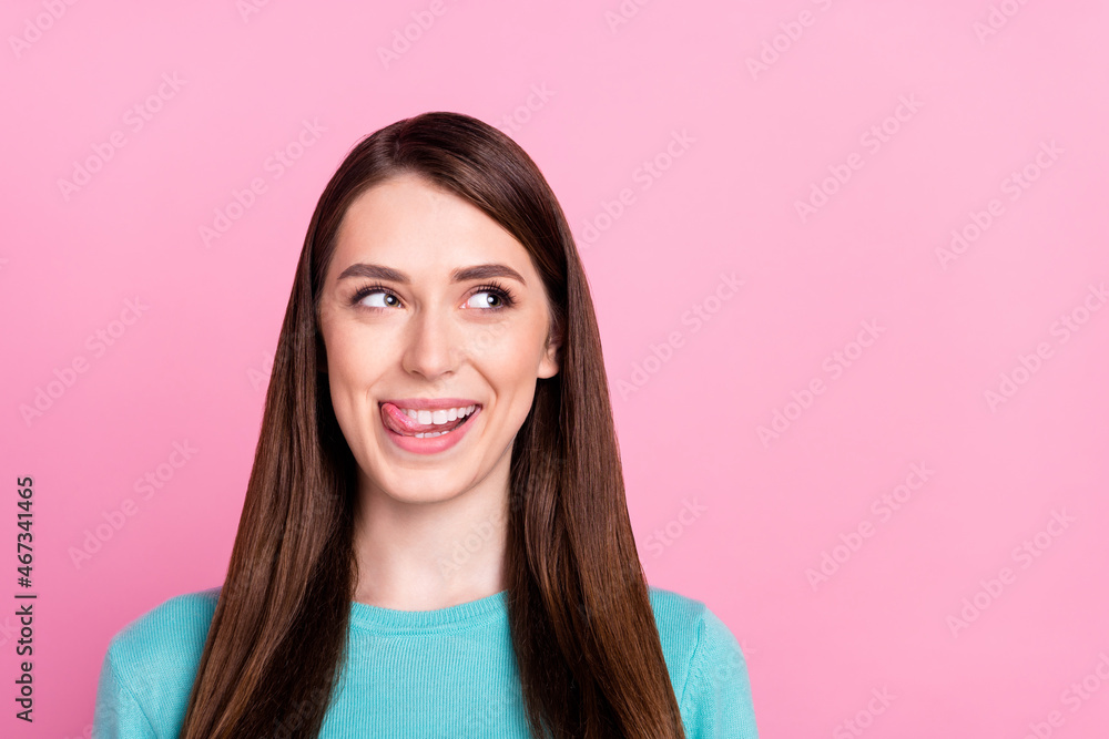 Photo portrait of pretty girl looking copyspace licking lips isolated on pastel pink color background Photo portrait of pretty girl looking copyspace licking lips isolated on pastel pink color background