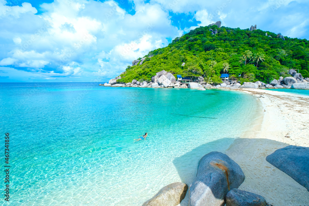 Fototapeta premium the woman on the beach, clear water sea with blue sky on the Holiday, swim on the turquoise water beach, at koh nang yuan island beach, koh tao ,suratthani , thailand