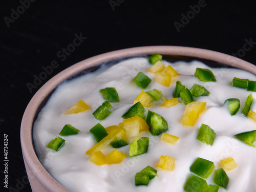 Chopped hot green and yellow pepper. Sour cream. Spicy