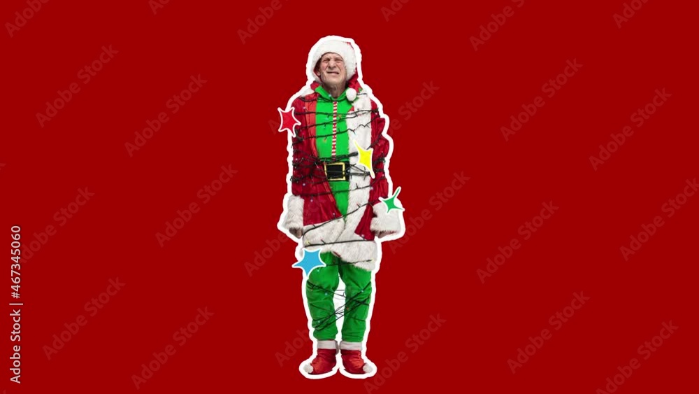 Happy Christmas, New Year. Stop motion design, art animation. Man as bad Santa in a festive garland on red . Funny, modern, conceptual, contemporary bright 4k artcollage. Party time concept Happy Christmas, New Year. Stop motion design, art animation. Man as bad Santa in a festive garland on red . Funny, modern, conceptual, contemporary bright 4k artcollage. Party time concept