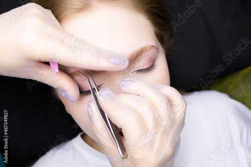 correction and plucking of excess hairs after the eyebrow lamination procedure