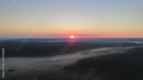 Sunrise over Misty Plains And Meadows from High Altitude Drone Aerial