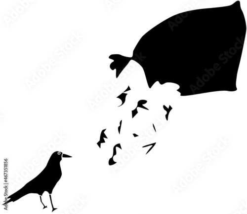 ゴミ袋を荒らすカラスのシルエット
