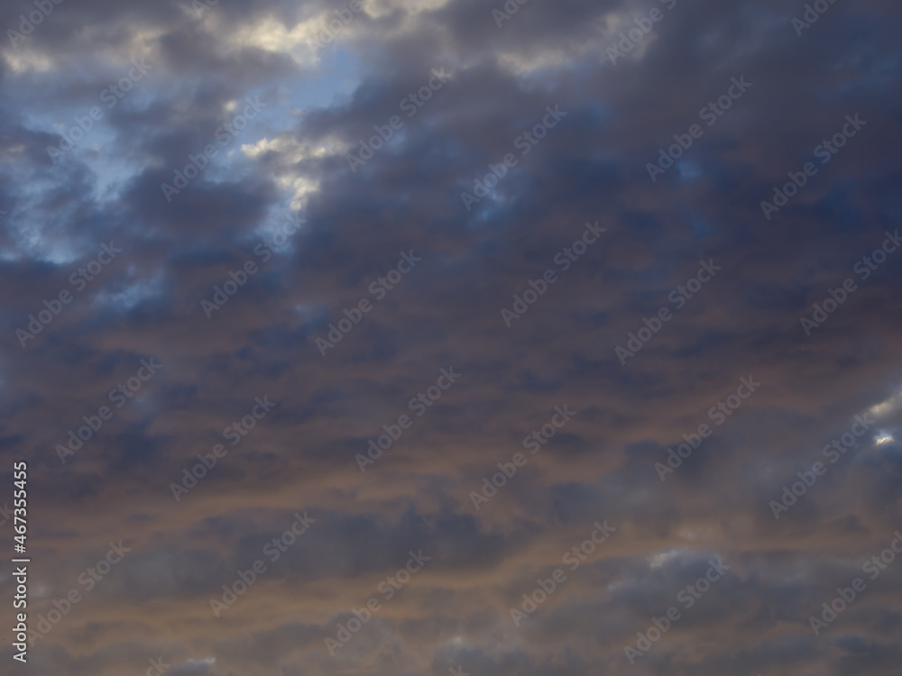 Dramatic cloudscape at sunset. Fancy clouds in the sky. Twilight heaven with orange light. Dramatic cloudscape at sunset. Fancy clouds in the sky. Twilight heaven with orange light.