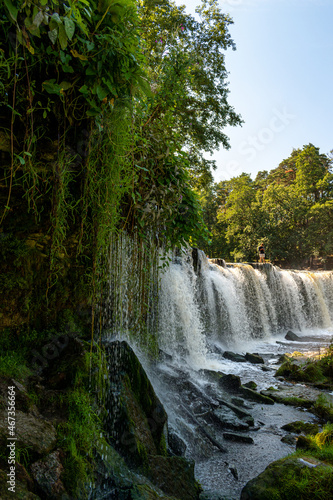 Keila waterfall located on Keila River in Harju County near Tallinn  Estonia. Water flowing in the middle of the forest