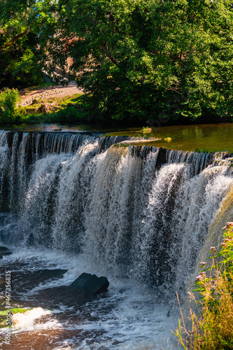 Keila waterfall located on Keila River in Harju County near Tallinn  Estonia. Water flowing in the middle of the forest