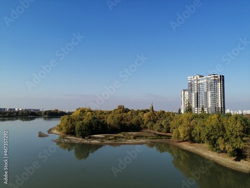 apartment building against the background of the sky and the river. cityscape