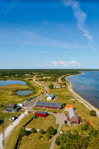 Aerial shot of the Sorve peninsula by the Baltic sea from the Sorve lighthouse in Saaremaa, Estonia. Clear blue sky, calm weather