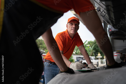 team service car workshop automobile. professional man shop maintenance