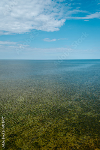 Fototapeta Naklejka Na Ścianę i Meble -  Aerial view over the Baltic sea from the Panga cliff in Saaremaa, Estonia during sunny day. the highest bedrock outcrop in western Estonia