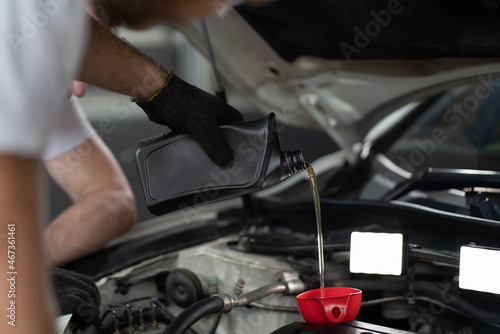 Mechanic changing engine, service car workshop automobile. professional man shop maintenance © Me studio