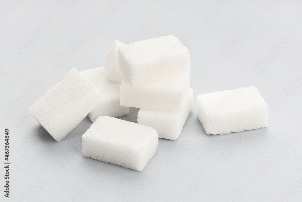 Sugar cubes on gray background. Close up Sugar cubes on gray background. Close up