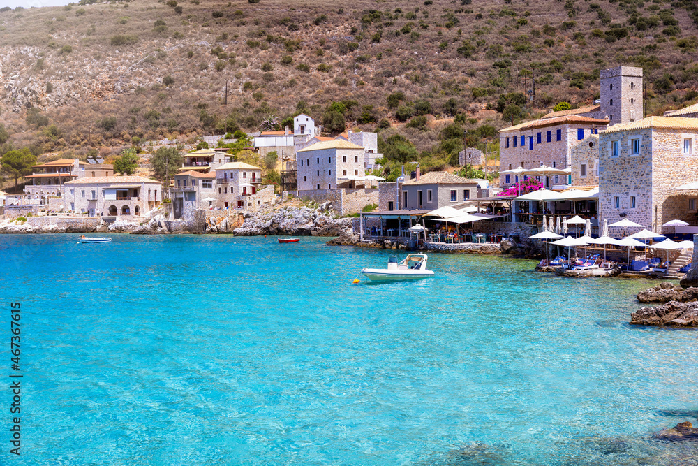 The idyllic fishing village of Limeni, Lakonia, Peloponnese, Greece, during summer time with turquoise shining sea