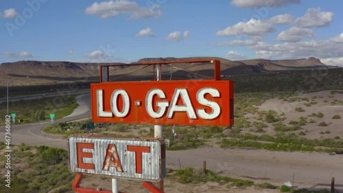 Aerial video of old abandoned gas station and diner in the desert with graffiti near Las Vegas Nevada.