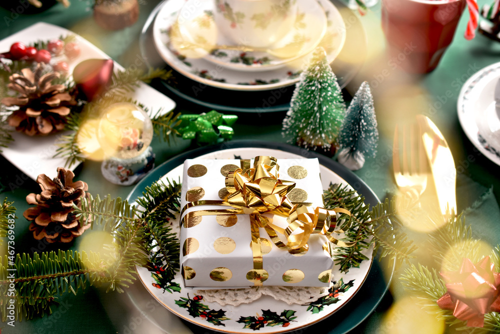Christmas table setting with decors and green tablecloth
