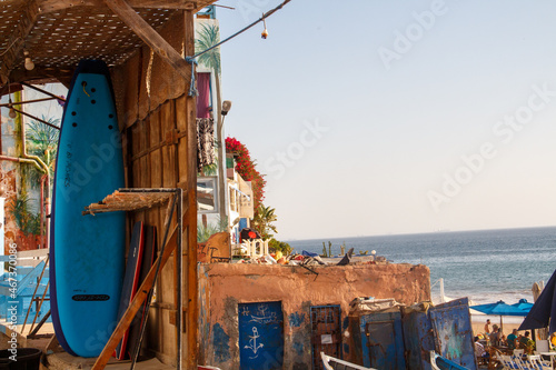 surfing boards shelved in front of beach