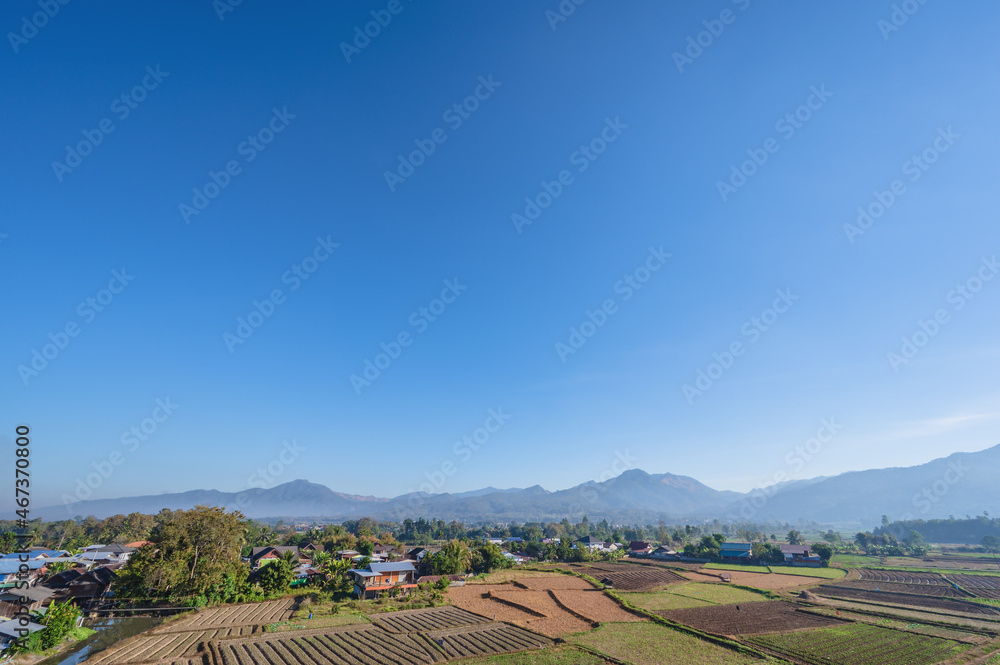 Landscape view of sunrise in the early morning and  sea of mist cover the mountian on the wat phuket temple viewpoint pua District nan.Pua  in the central part of Nan Province, northern Thailand