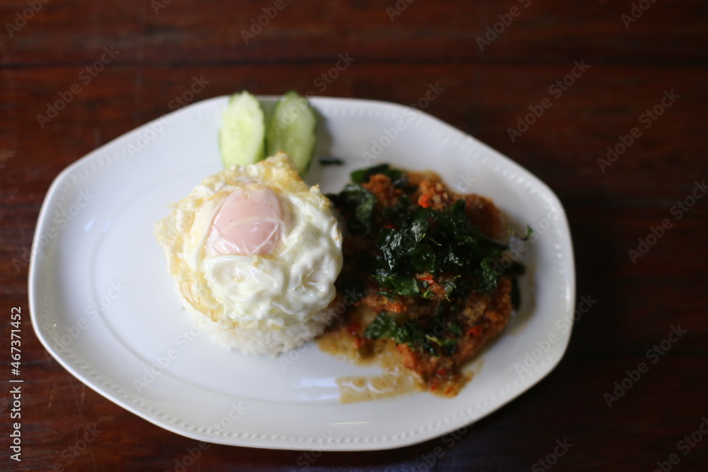 Stir Fried Basil with Crispy Chicken with Rice and Fried Egg Stir Fried Basil with Crispy Chicken with Rice and Fried Egg