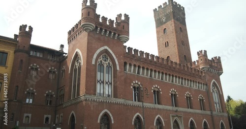 Neo gothic palace. Medici del Vascello neo-Gothic palace in Asti.Building with red brick walls and battlements located in the historic center, in Piazza Roma.   photo