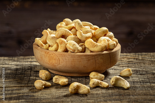 Cashew nuts in a wooden bowl photo