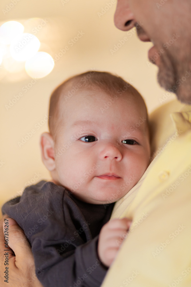 Cute baby in hands of crop anonymous father Cute baby in hands of crop anonymous father