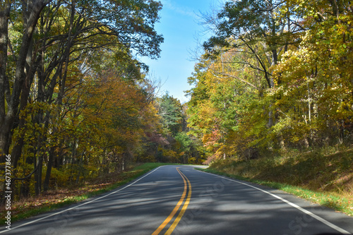 Winding Country Road Traveling Through Beautiful Fall Foliage