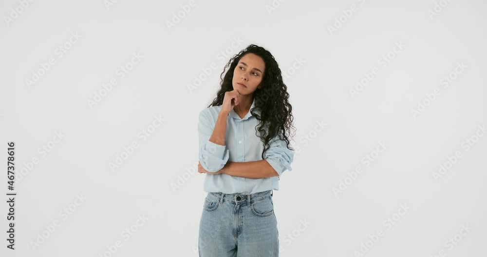Confused woman coming up with a good idea over white background Confused woman coming up with a good idea over white background
