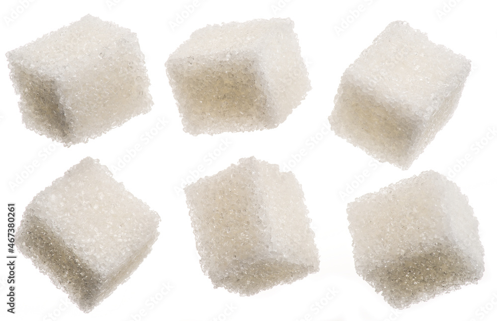White sugar cubes on white background. Macro picture. White sugar cubes on white background. Macro picture.