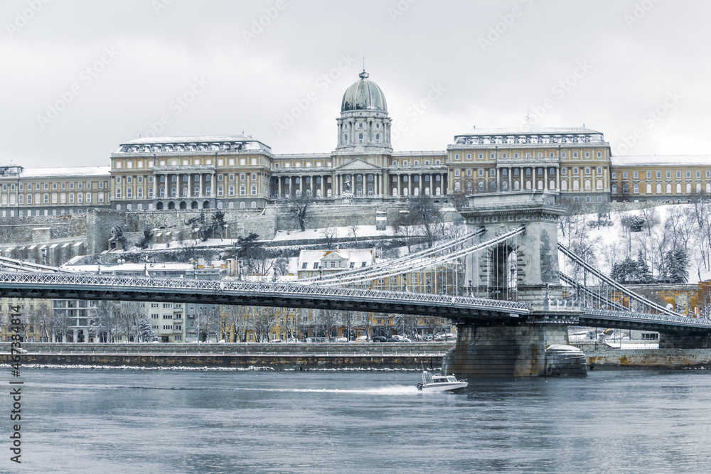 the Buda castle and the Chain Bridge above the Danube river in Budapest, Hungary, in winter