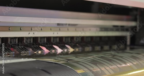Modern Digital Large format UV printer. Printing production technologies. UV pinning is the process of applying a dose of low intensity ultraviolet light to a UV curable ink
