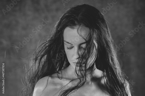 Portrait shot of a pretty young woman. Black and white photography