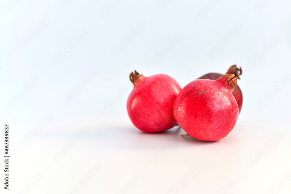 Several pomegranates on white background. Several pomegranates on white background.