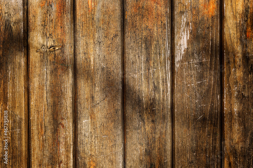 The surface of an old wooden wall made of vertical planks. Construction and repair. Background. Space for text.