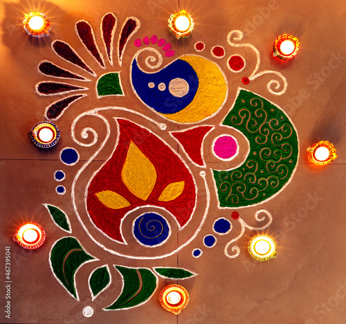 Canvastavla Colourful rangoli with deepak