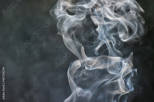 white smoke on a dark background