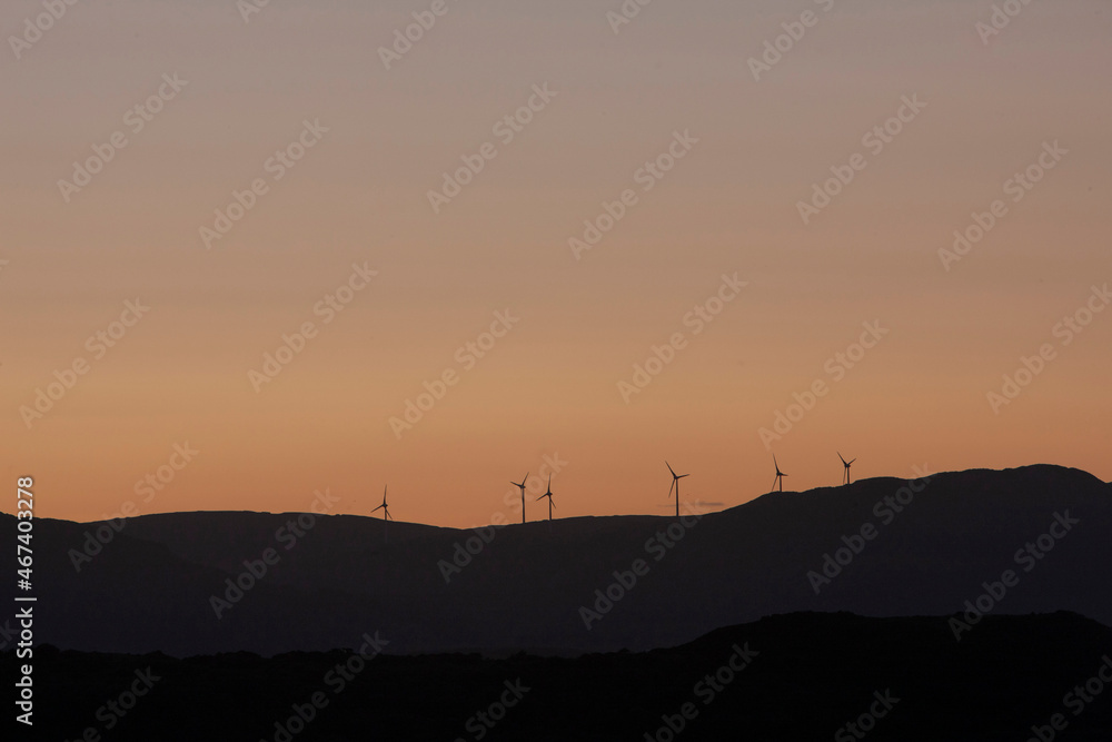 Mountains with windmills sunset. Green energy. Westcoast Ireland. Wind energy.