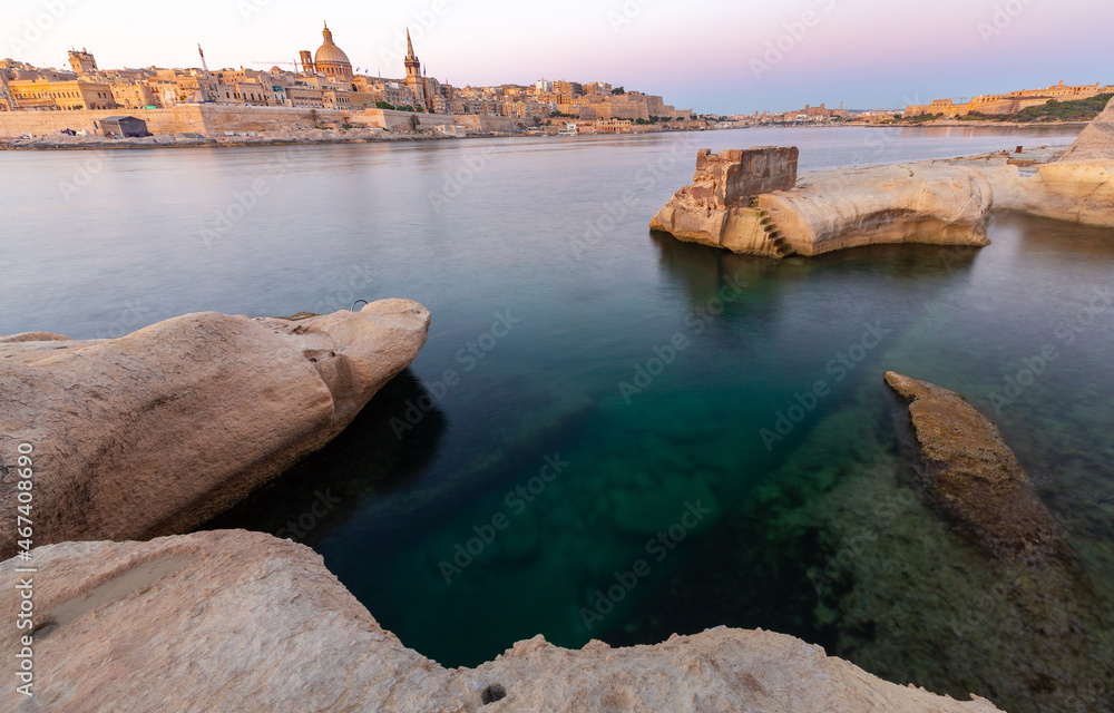 Malta. The coastline along Valletta and the harbor at sunrise.