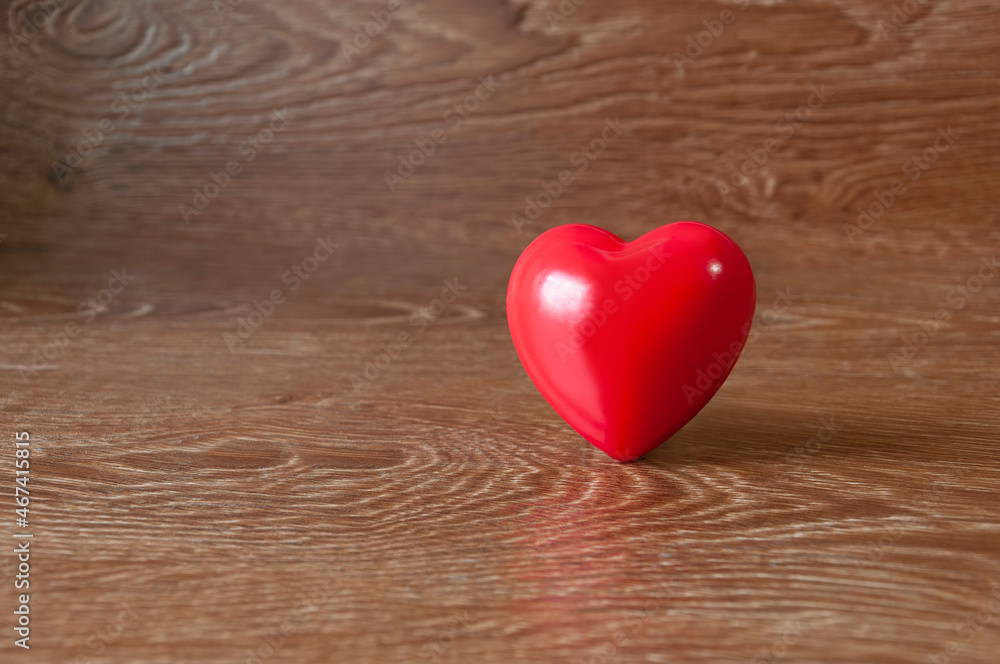 Heart of red on a background of brown boards. Heart of red on a background of brown boards.