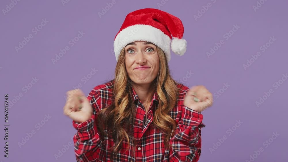 Merry confused shy shamed young Santa woman wears shirt Christmas hat look camera spreading hands say oops ouch oh omg i am so sorry isolated on plain pastel light violet background studio portrait Merry confused shy shamed young Santa woman wears shirt Christmas hat look camera spreading hands say oops ouch oh omg i am so sorry isolated on plain pastel light violet background studio portrait