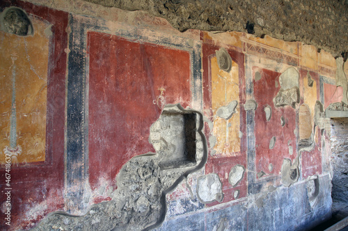 Plaster and paint in Pompeian colors, damaged and ruined by time, Pompeii, Campania, Italy photo